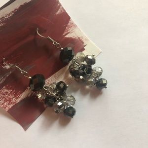 Black beaded dangle earrings with a hook back